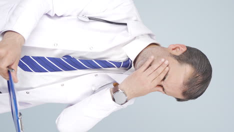 Vertical-video-of-Doctor-with-occupational-fatigue.